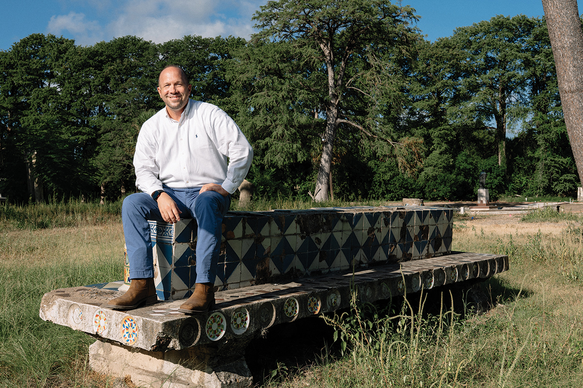 Chris Mitre sitting on concrete structure