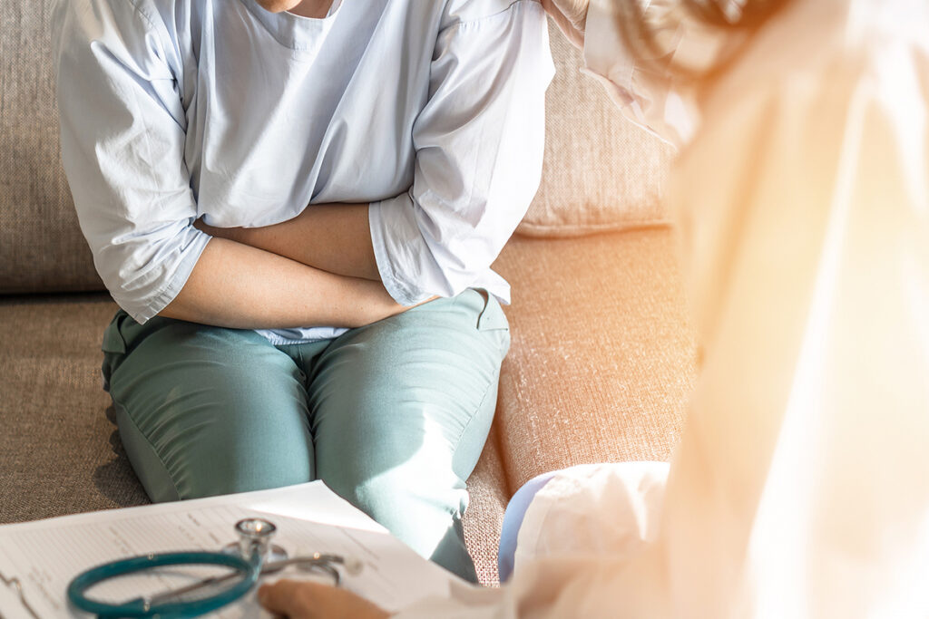 Abdominal Pain Patient Woman Having Medical Exam With Doctor On