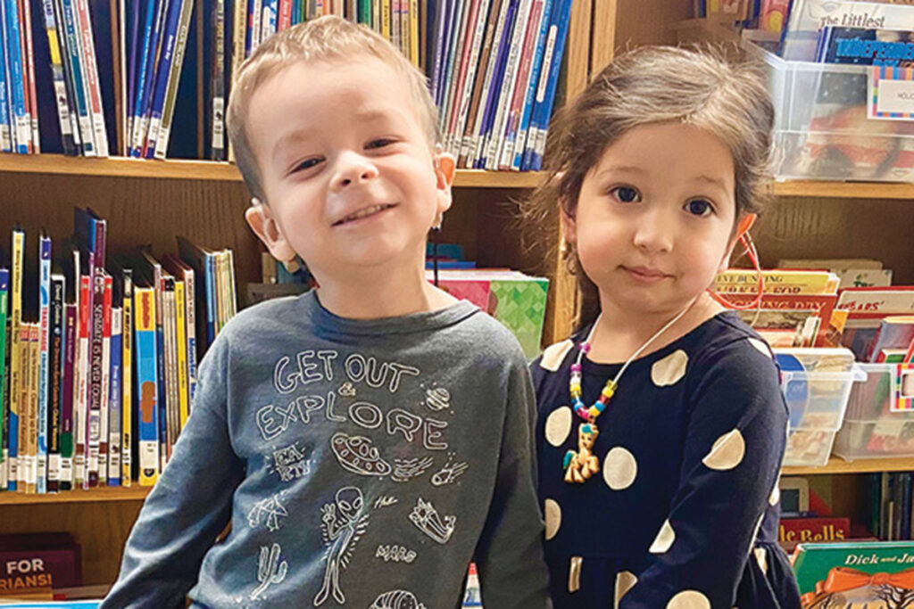 Sunshine Cottage cute boy and girl in library web