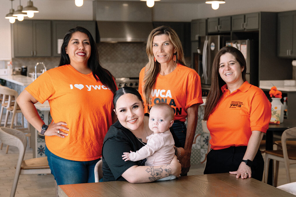 YWCA employees with mother and baby